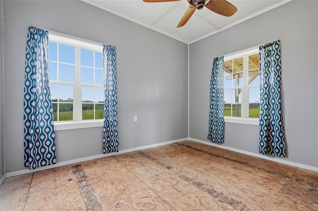 1464 Keyes Road Sherman, TX 75092 - Photo 18 of 29 a view of an empty room with a window and chandelier