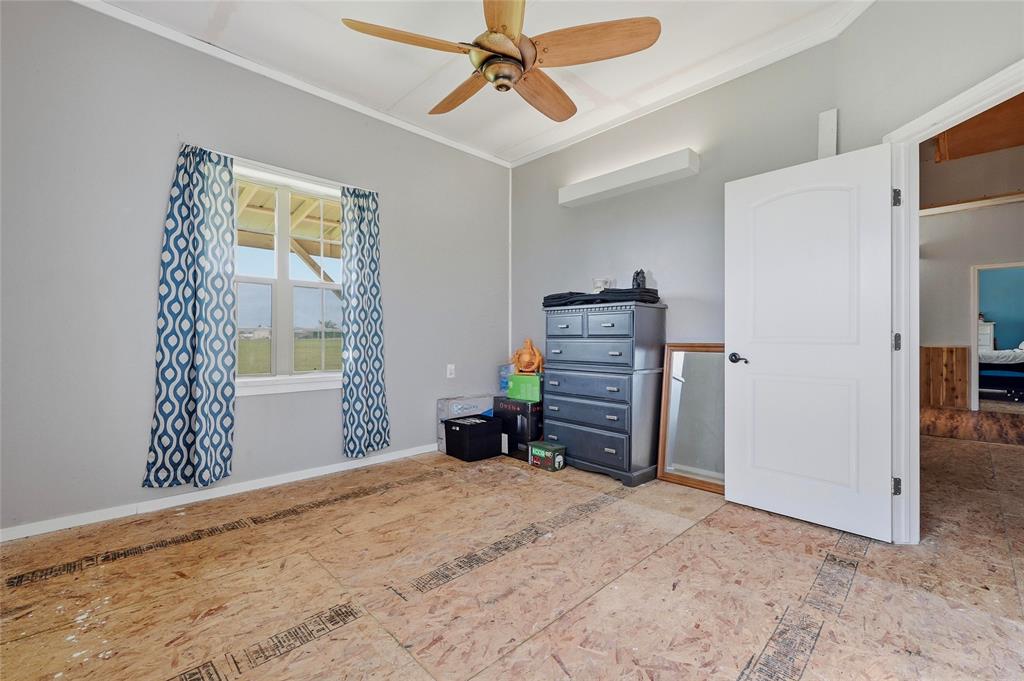 1464 Keyes Road Sherman, TX 75092 - Photo 19 of 29 a view of a livingroom with furniture and a refrigerator