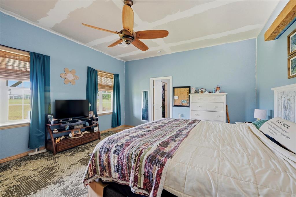 1464 Keyes Road Sherman, TX 75092 - Photo 20 of 29 a bedroom with a bed and a flat tv screen on dresser