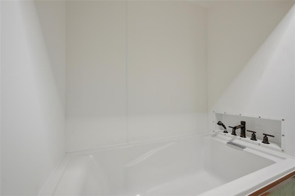 1464 Keyes Road Sherman, TX 75092 - Photo 23 of 29 a close up of a bathtub