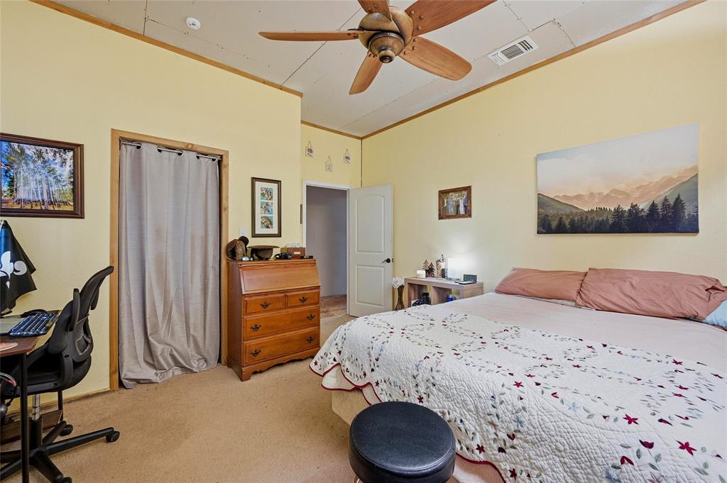 1464 Keyes Road Sherman, TX 75092 - Photo 6 of 29 a bedroom with a bed and a chandelier