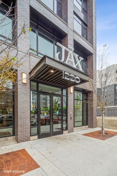 front view of a building with a garden