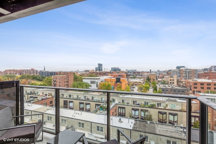 1220 West Jackson Boulevard, Unit 814 Chicago, IL 60607 - Photo 5 of 10 a view of a city from a balcony with seating space