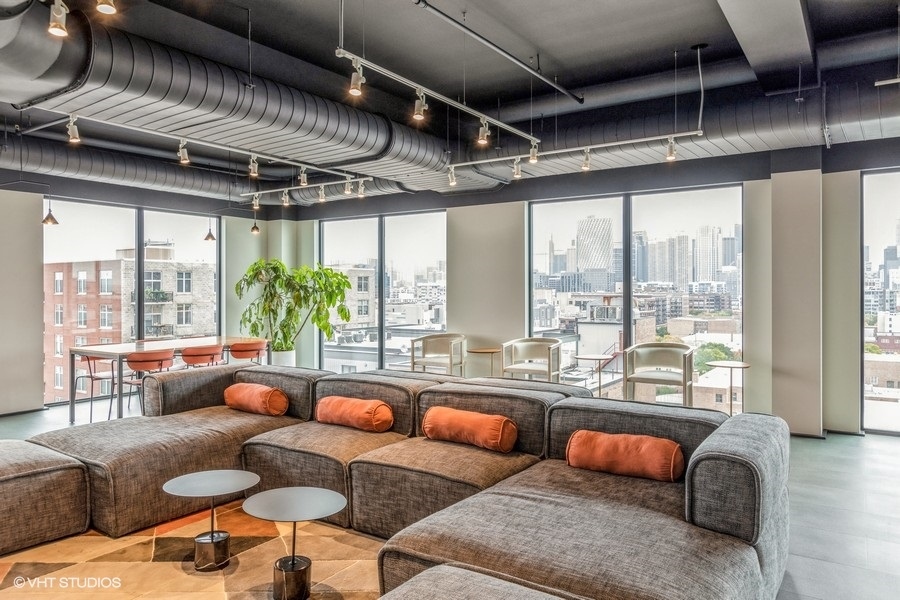 1220 West Jackson Boulevard, Unit 814 Chicago, IL 60607 - Photo 8 of 10 a living room with furniture and a large window