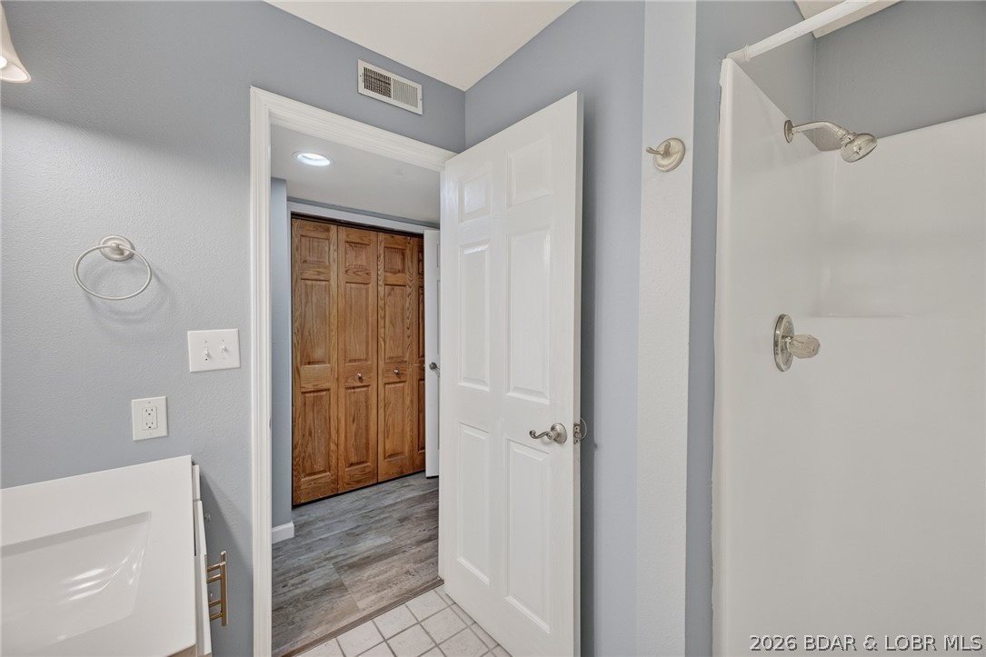 1111 Passover Road, Unit N1 Osage Beach, MO 65065 - Photo 46 of 57 2nd bath with walk in shower.