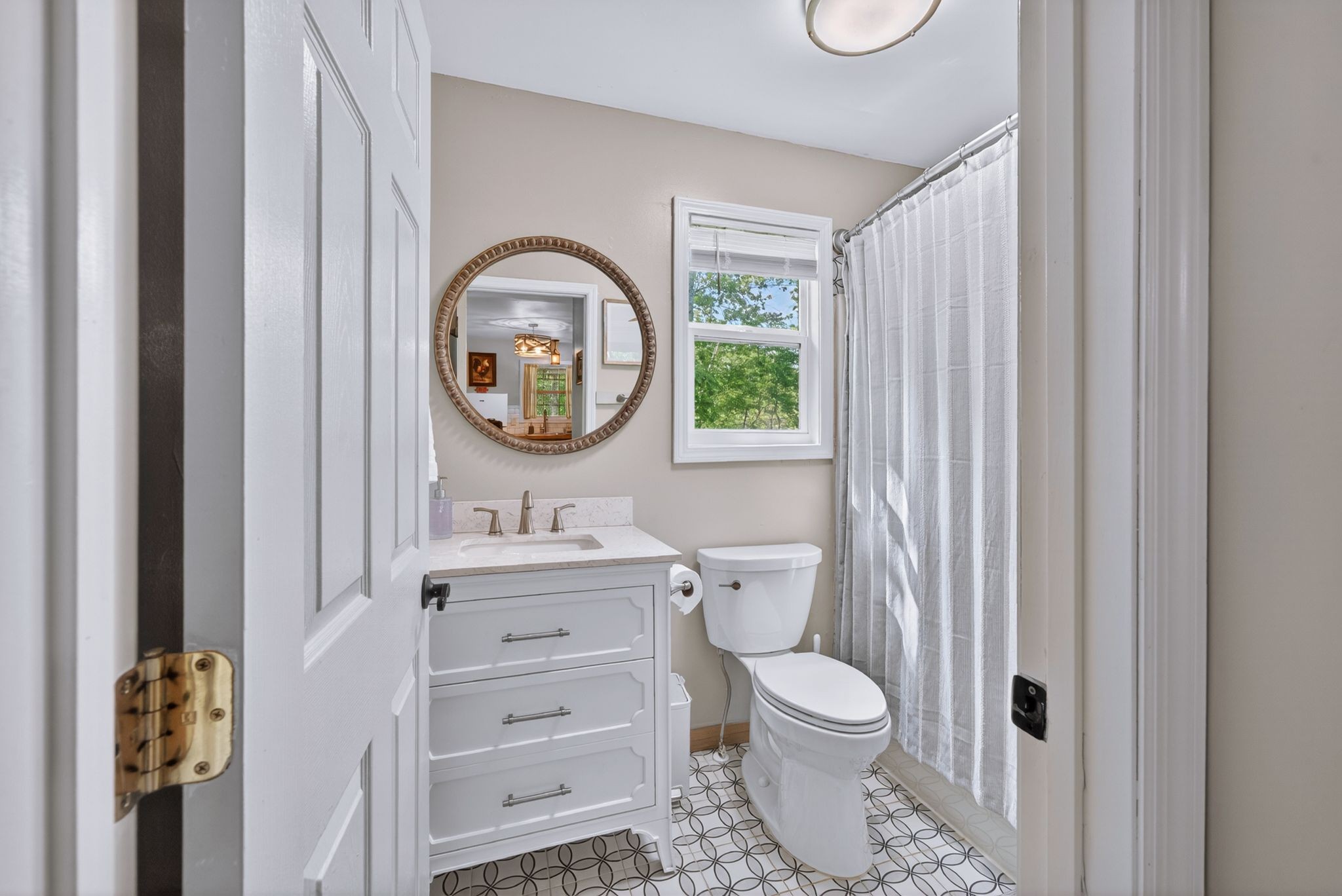 1030 Johnson Hollow Road McEwen, TN 37101 - Photo 14 of 78 a bathroom with a toilet a sink and a mirror