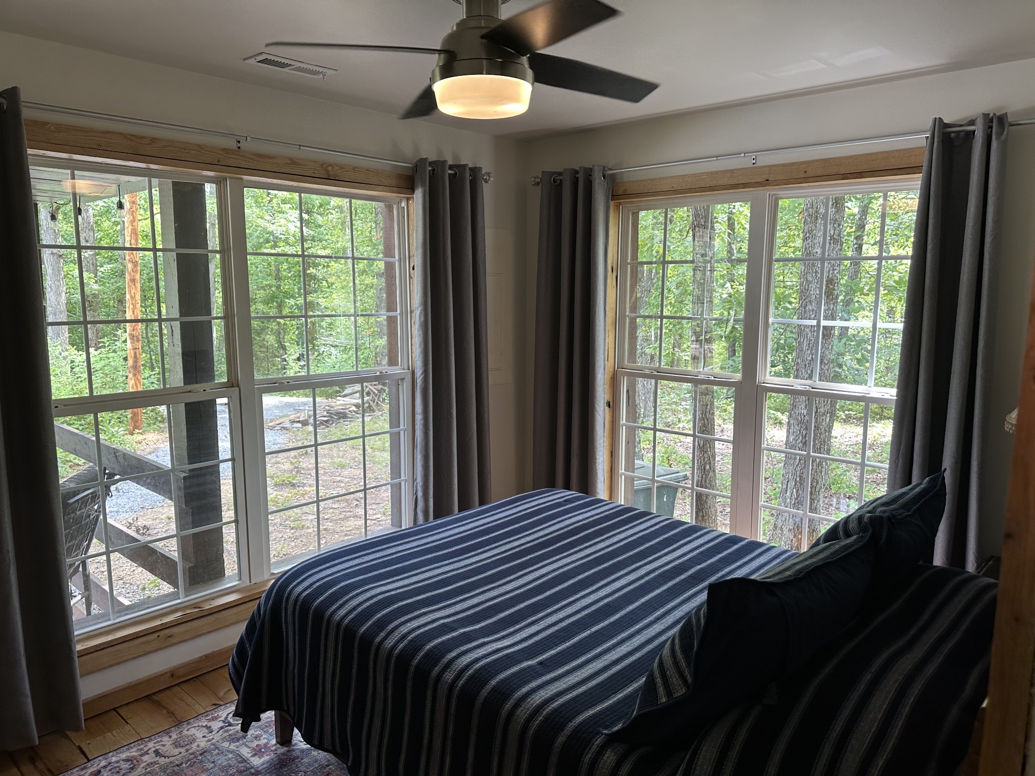 1030 Johnson Hollow Road McEwen, TN 37101 - Photo 47 of 78 a bedroom with a large bed and a large window
