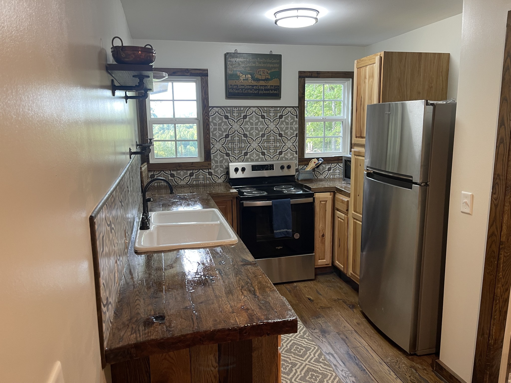 1030 Johnson Hollow Road McEwen, TN 37101 - Photo 53 of 78 a kitchen with stainless steel appliances granite countertop a refrigerator a stove a sink and a microwave