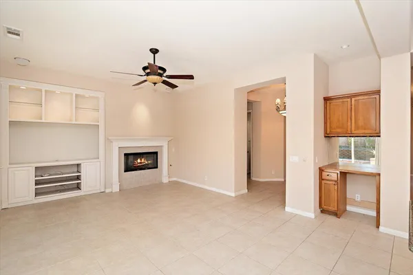 wooden floor in an empty room with a fireplace
