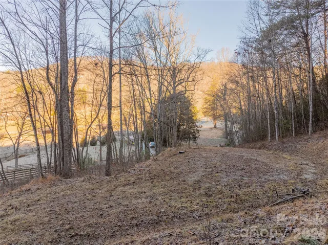 a view of outdoor space with wooden fence