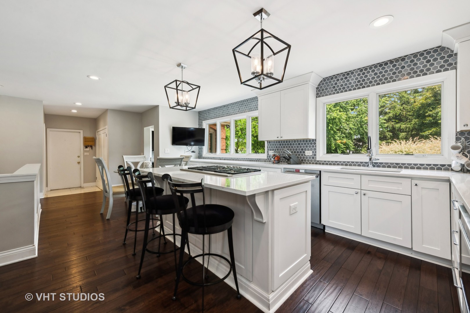 1766 Firth Road Inverness, IL 60067 - Photo 13 of 53 a kitchen with stainless steel appliances granite countertop wooden floors and white cabinets