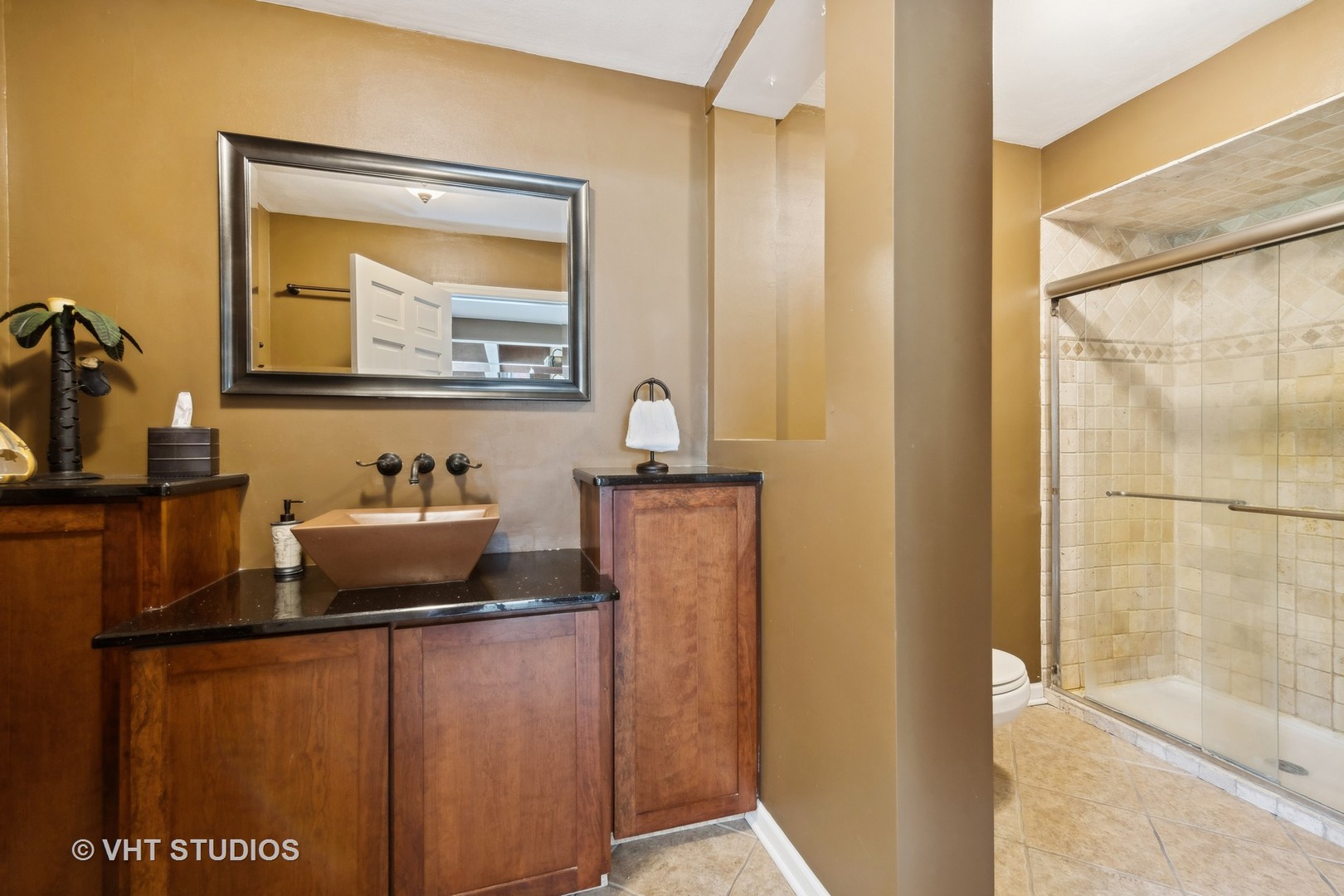 1766 Firth Road Inverness, IL 60067 - Photo 36 of 53 a bathroom with a sink a mirror and a vanity