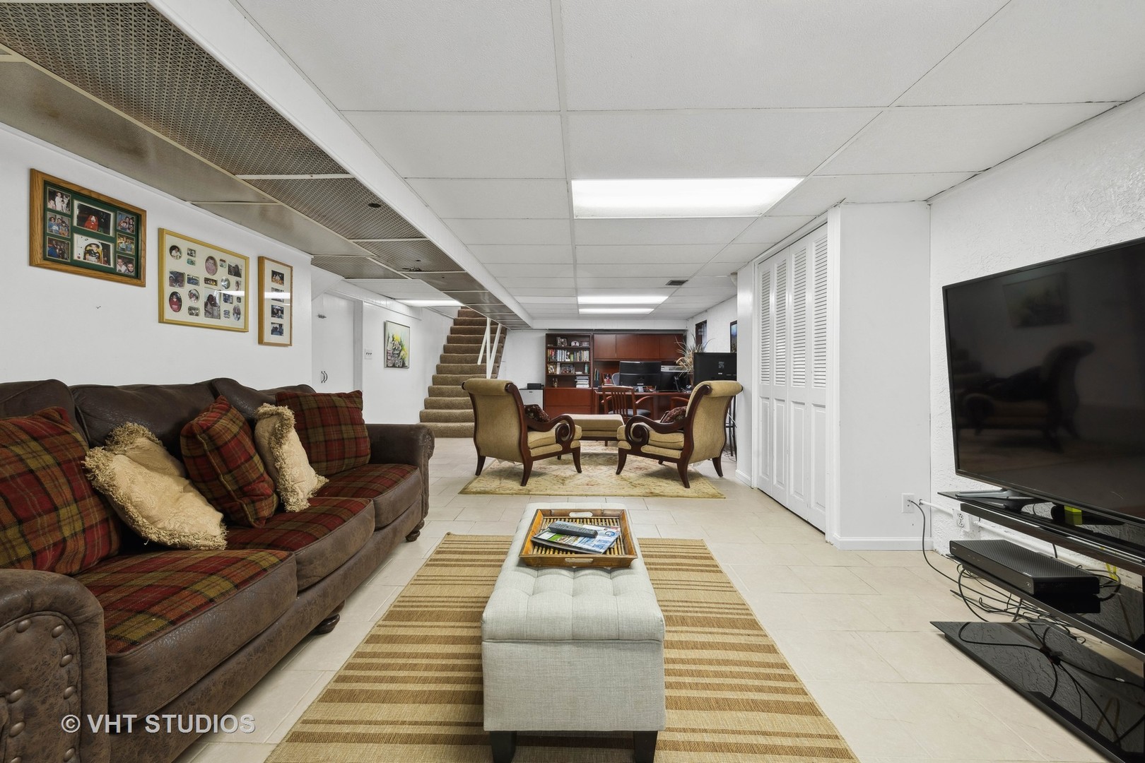 1766 Firth Road Inverness, IL 60067 - Photo 39 of 53 a living room with furniture and a flat screen tv