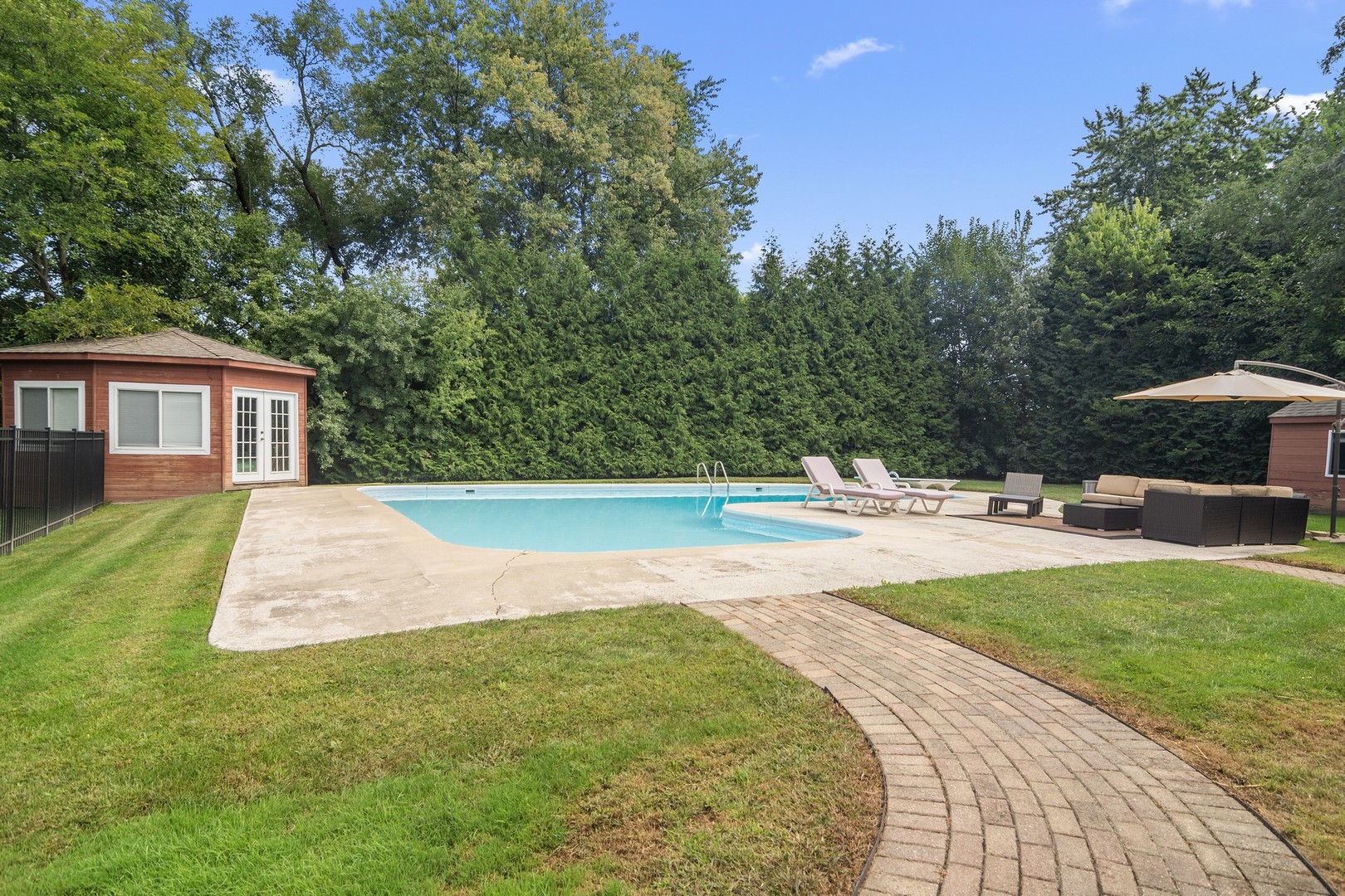 1766 Firth Road Inverness, IL 60067 - Photo 41 of 53 a view of swimming pool with a patio and a yard
