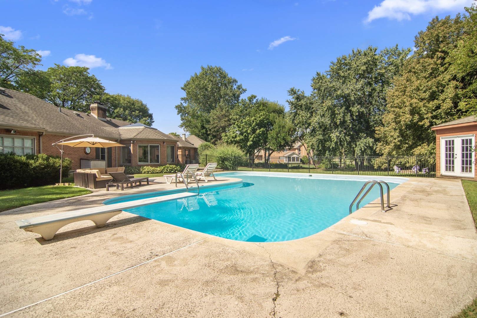 1766 Firth Road Inverness, IL 60067 - Photo 44 of 53 a view of swimming pool with outdoor seating and trees in the background