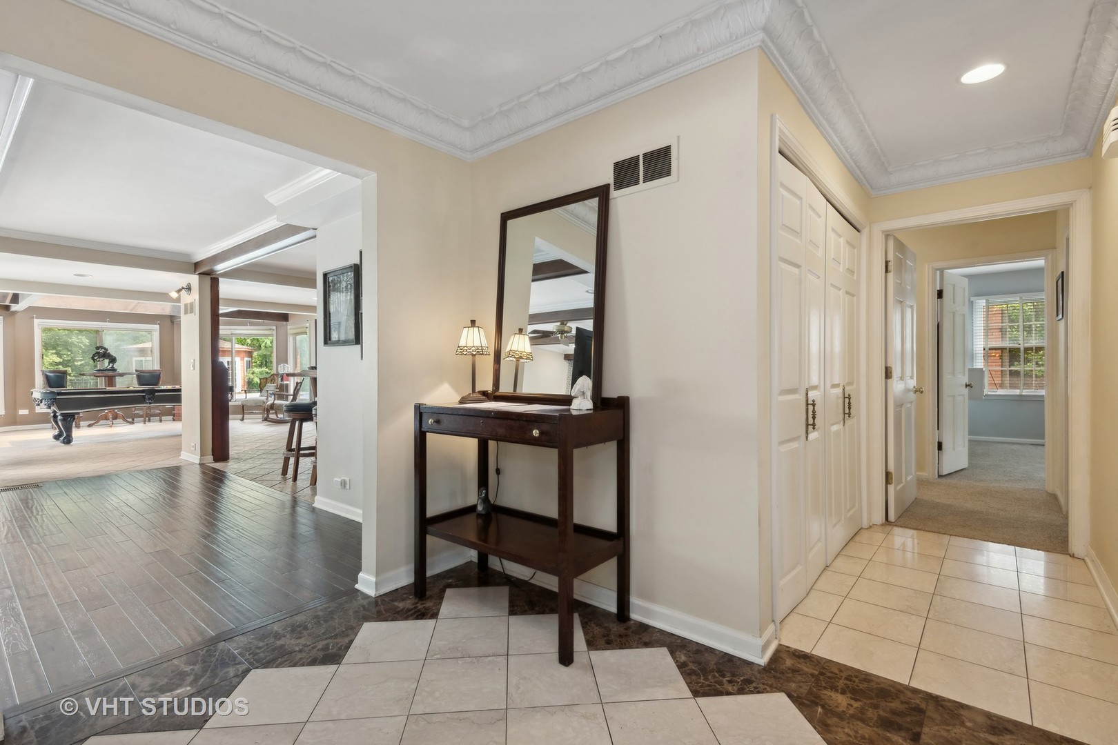 1766 Firth Road Inverness, IL 60067 - Photo 7 of 53 a view of a hallway with wooden floor and a bathroom