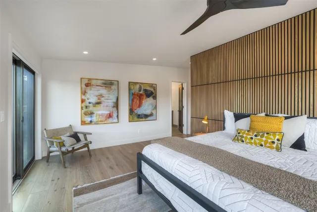 a bedroom with a bed and a couch