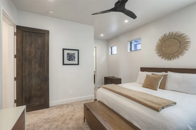 a bedroom with a bed and cabinets