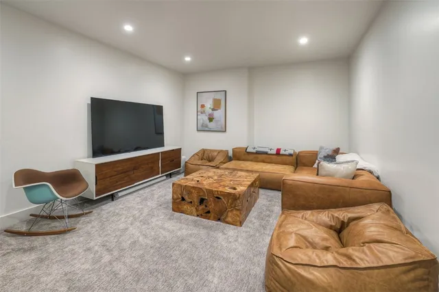 a bedroom with bed and a flat screen tv