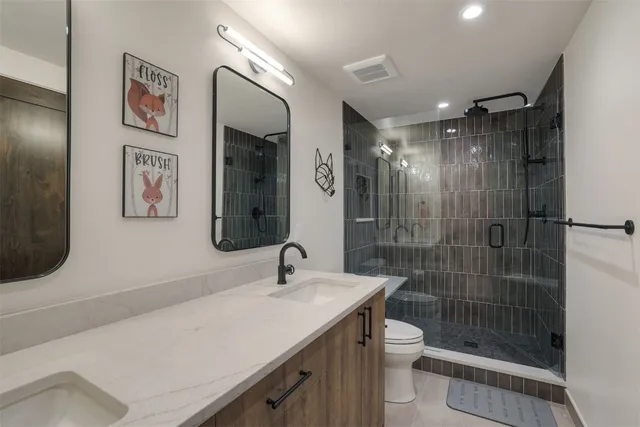 a bathroom with a toilet sink and shower
