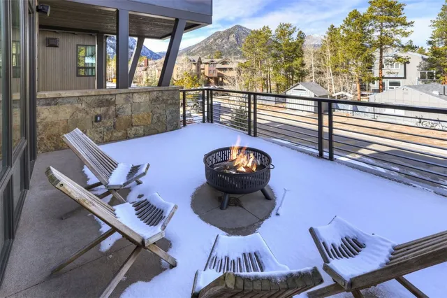 a view of a chairs and tables on the balcony