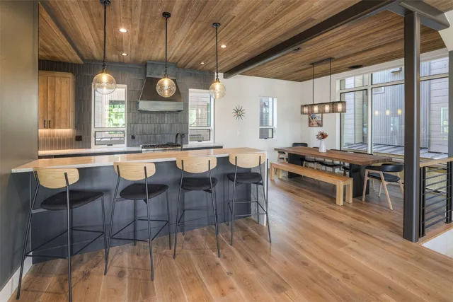 a large kitchen with lots of counter space and stainless steel appliances