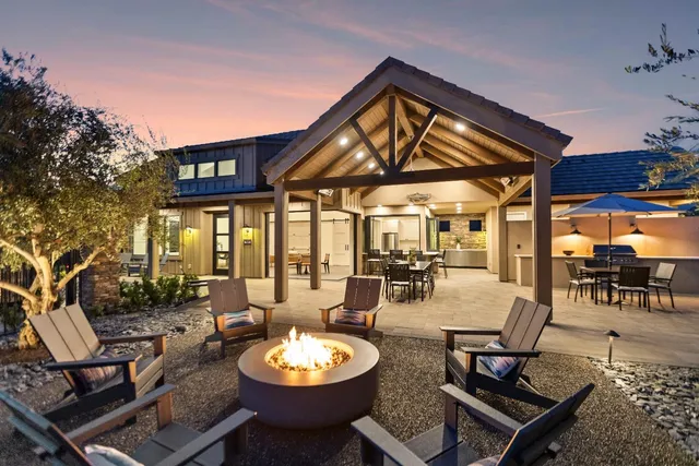 a view of a dinning table and chairs in the patio