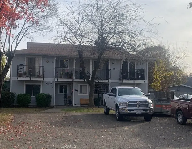 a view of a car parked in front of a house