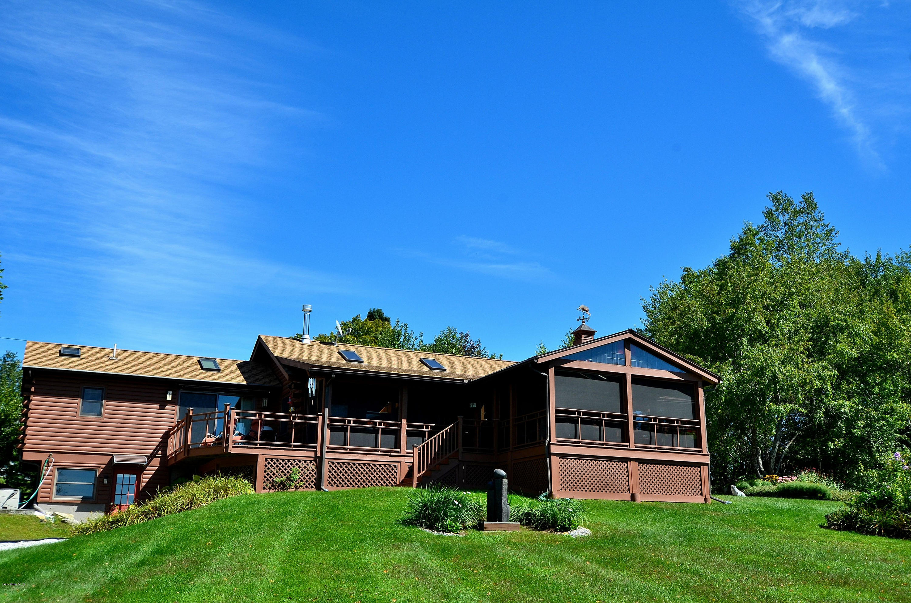 286 Johnson Hill Road Washington, MA 01223 - Photo 2 of 30 a front view of a house with a yard