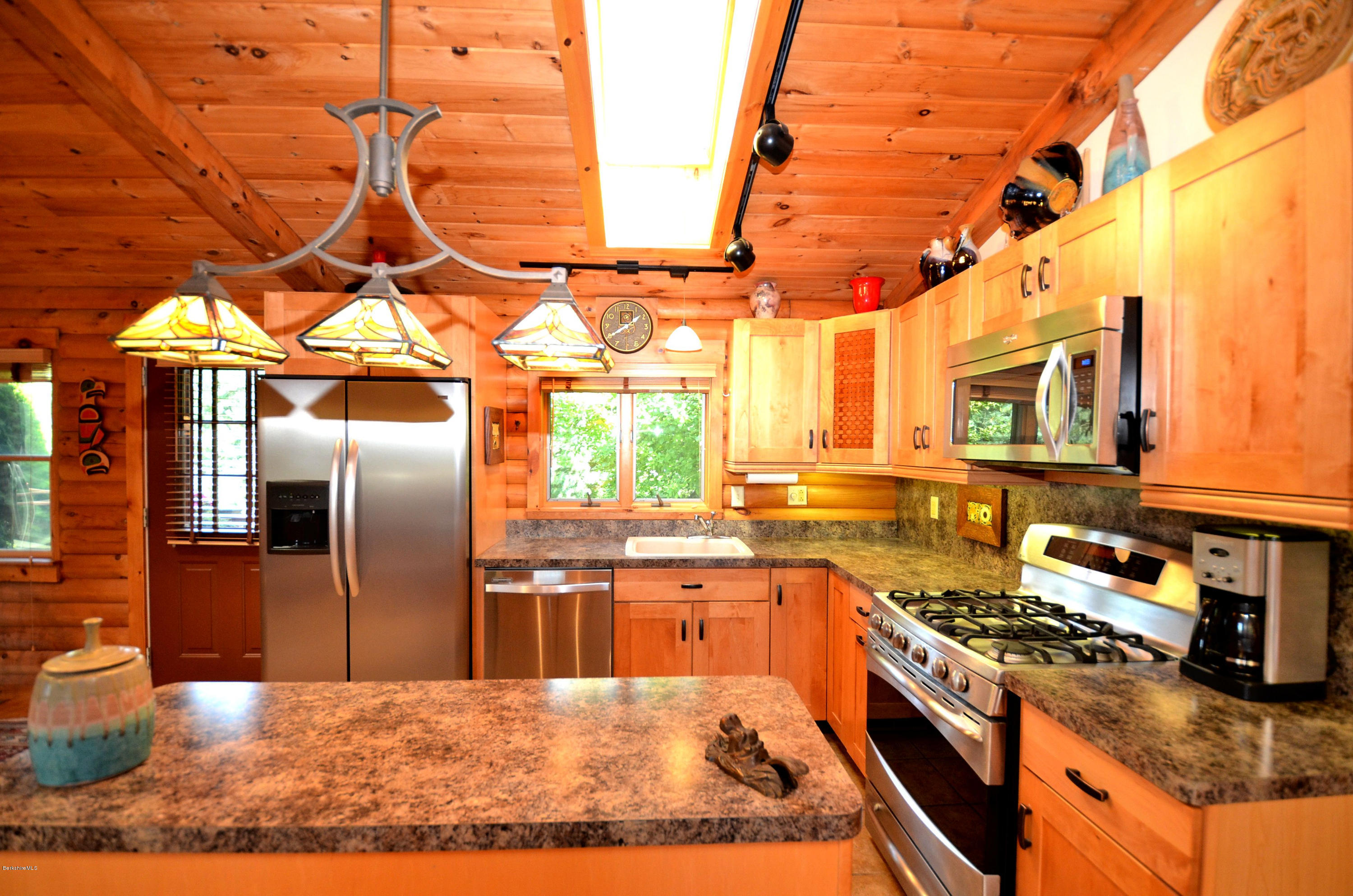 286 Johnson Hill Road Washington, MA 01223 - Photo 19 of 30 a kitchen with stainless steel appliances granite countertop a stove a sink and a refrigerator