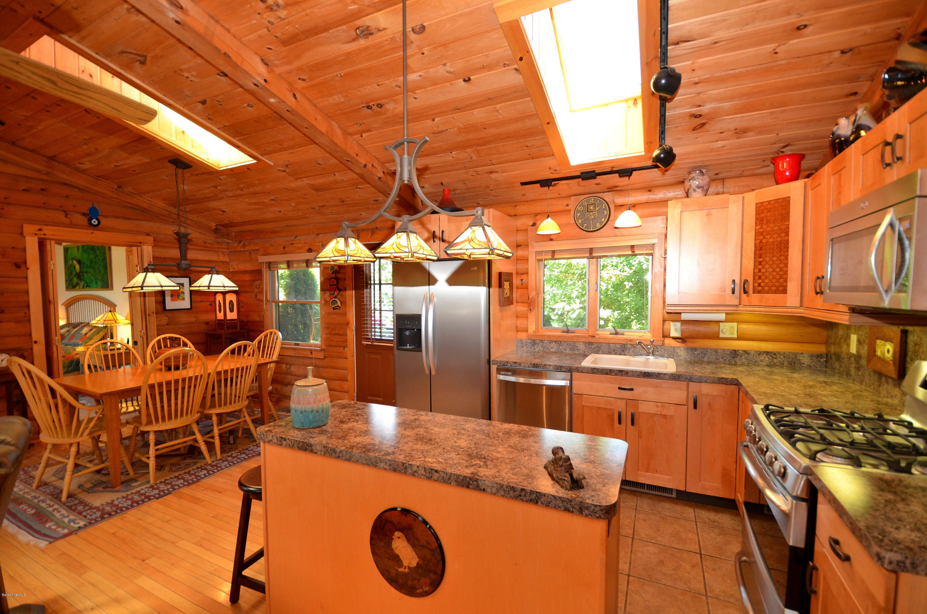 286 Johnson Hill Road Washington, MA 01223 - Photo 21 of 30 a kitchen with stainless steel appliances granite countertop a stove a sink and a refrigerator