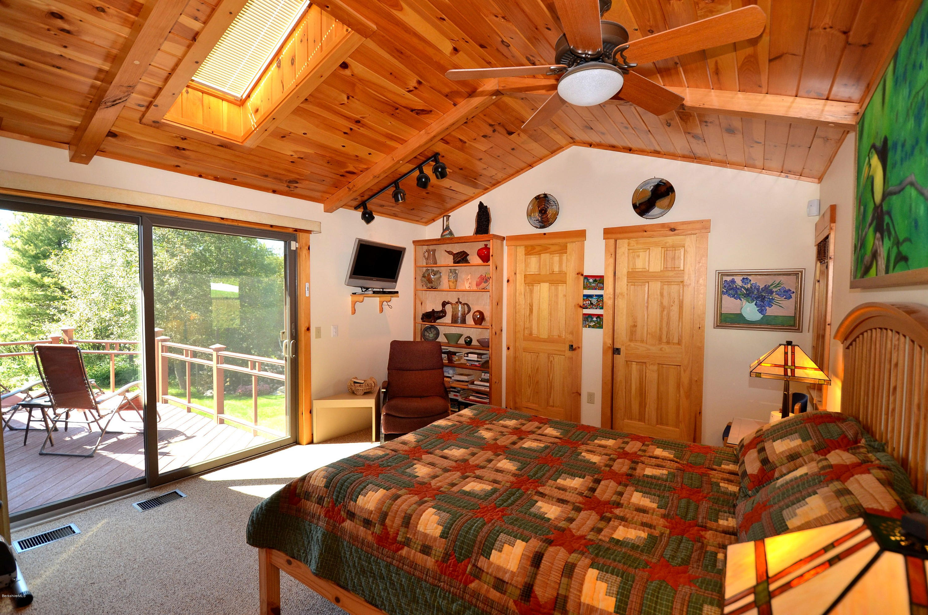 286 Johnson Hill Road Washington, MA 01223 - Photo 24 of 30 a bedroom with a bed and a dresser next to a window