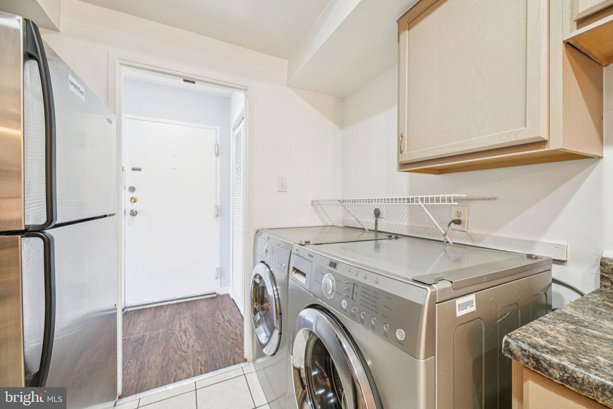 10216 Prince Place, Unit 9202 Upper Marlboro, MD 20774 - Photo 13 of 32 a utility room with dryer and washer