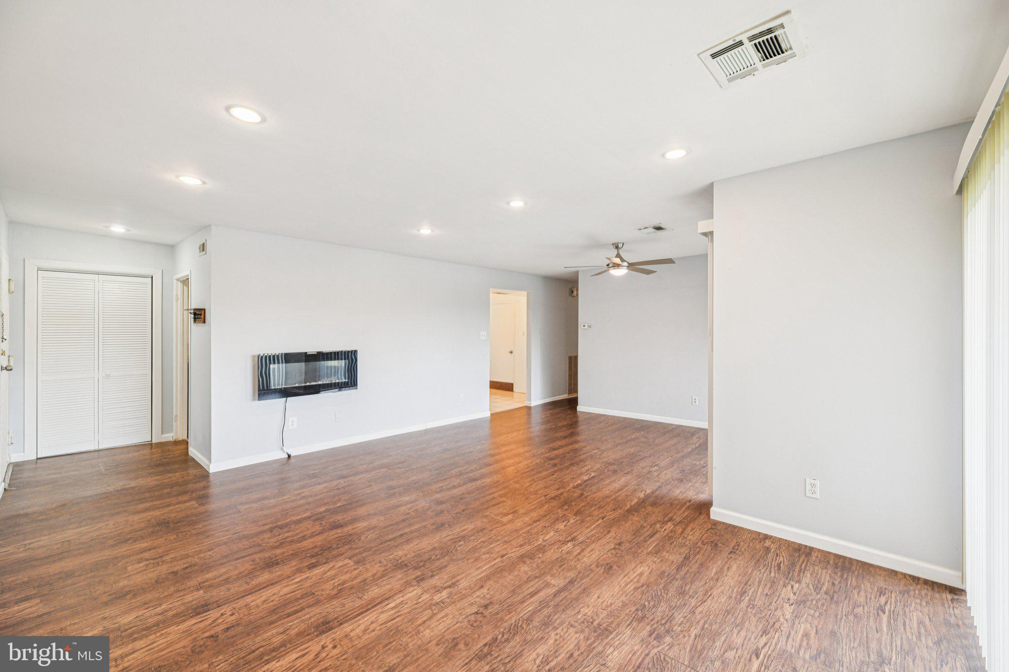 10216 Prince Place, Unit 9202 Upper Marlboro, MD 20774 - Photo 6 of 32 a view of empty room with wooden floor