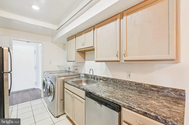 a kitchen with a sink stove and refrigerator