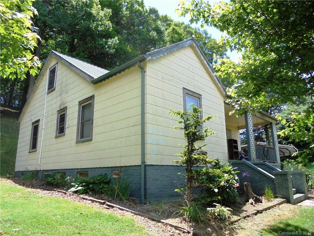 108 Howell Road Marshall, NC 28753 - Photo 14 of 26 a view of a house with a yard and plants