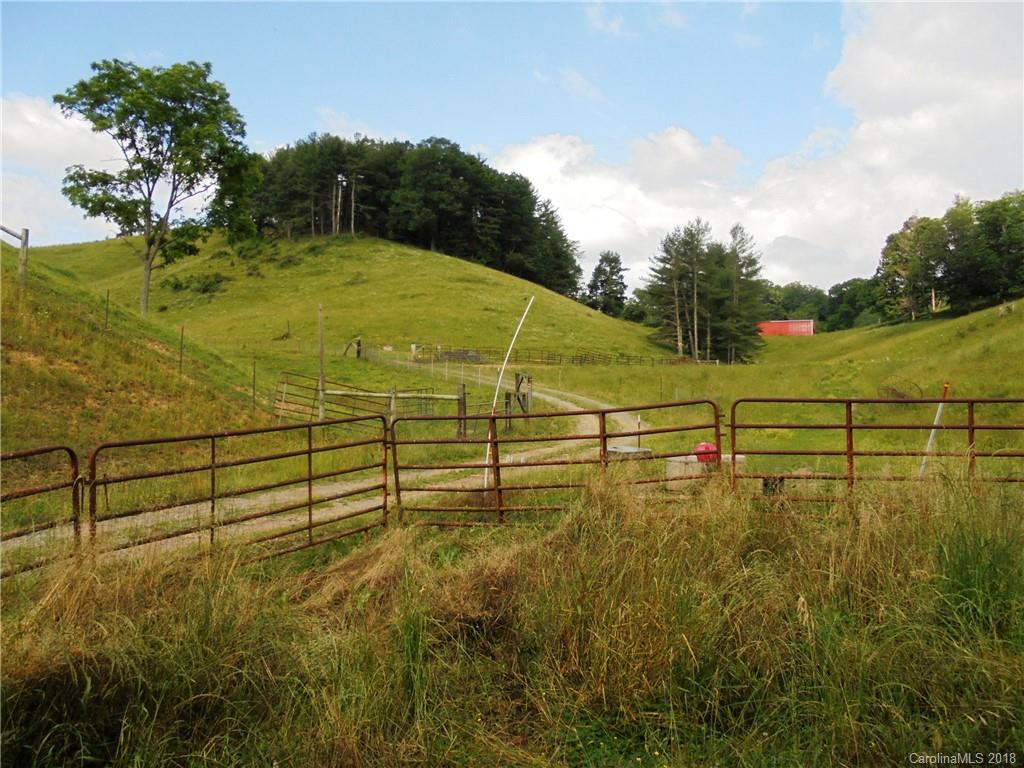 108 Howell Road Marshall, NC 28753 - Photo 17 of 26 a view of a lake with a yard
