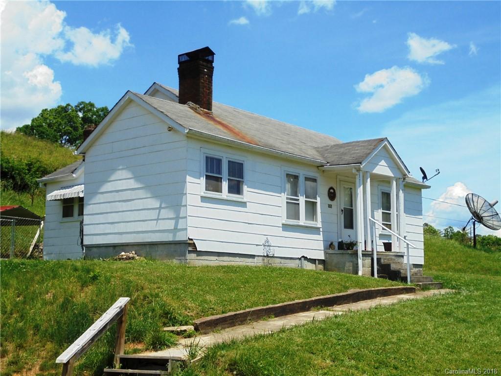 108 Howell Road Marshall, NC 28753 - Photo 20 of 26 a view of a house with a backyard