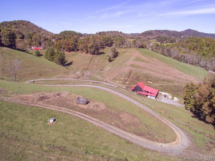 108 Howell Road Marshall, NC 28753 - Photo 4 of 26 a view of a lake with a mountain in the background