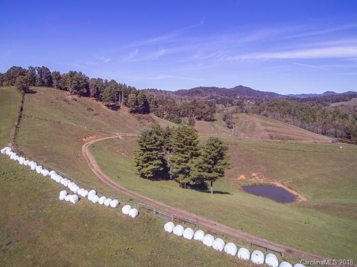 108 Howell Road Marshall, NC 28753 - Photo 6 of 26 a view of a lake with a mountain in the background