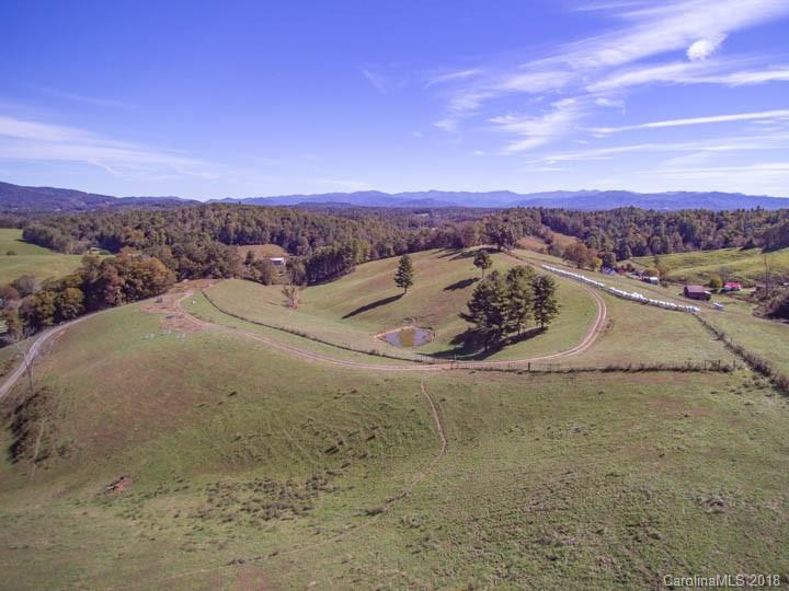 108 Howell Road Marshall, NC 28753 - Photo 10 of 26 a view of a lake in front of a house