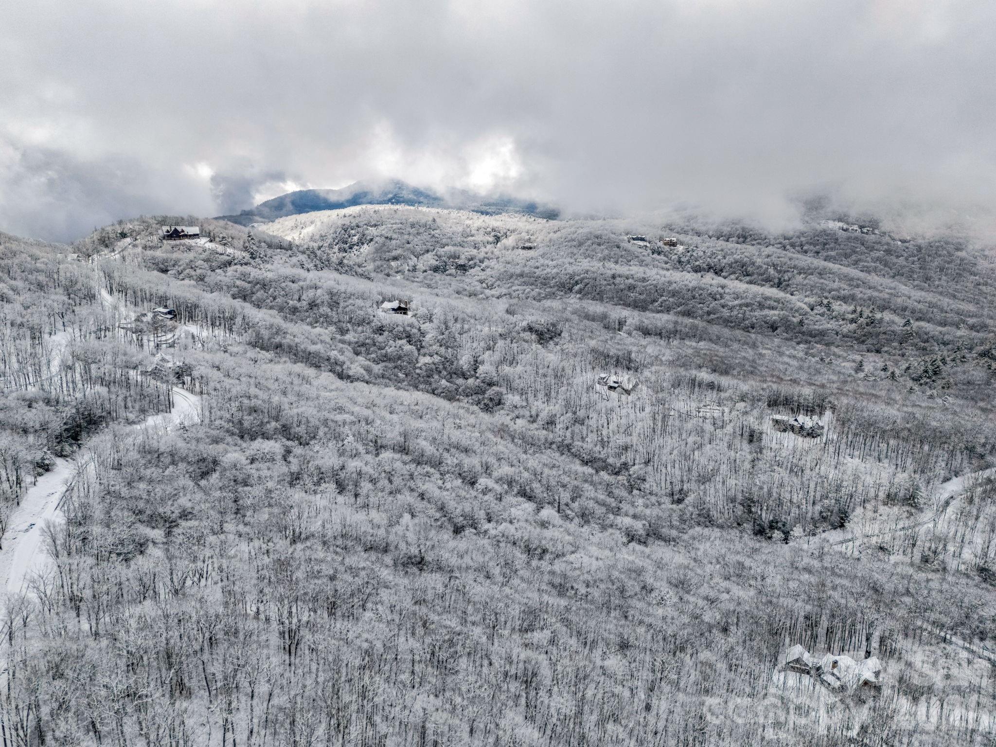D54 Springwater Road, Unit D54 Glenville, NC 28736 - Photo 8 of 26 a view of empty room and mountain view