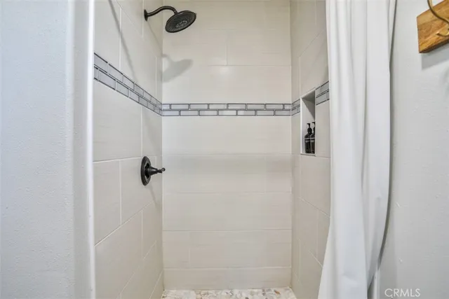 a balcony with table and chairs