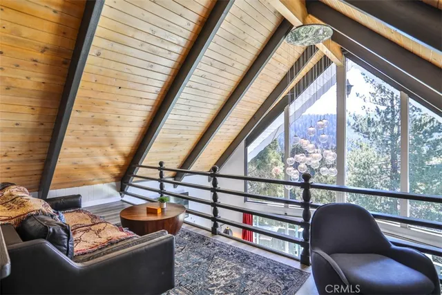 a view of a balcony with a chair and potted plant