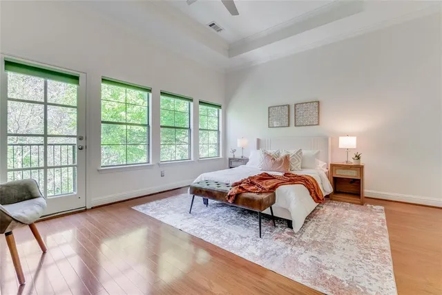 a bedroom with a bed and a large window