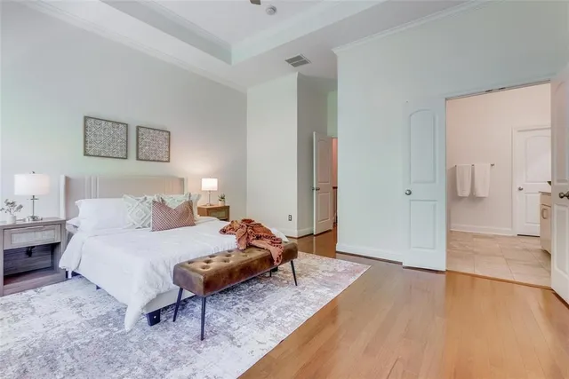 a bedroom with a bed and a table in it