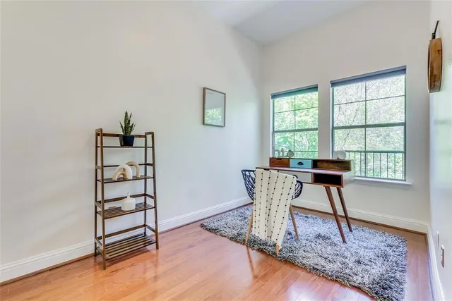 a view of a livingroom with furniture and a window