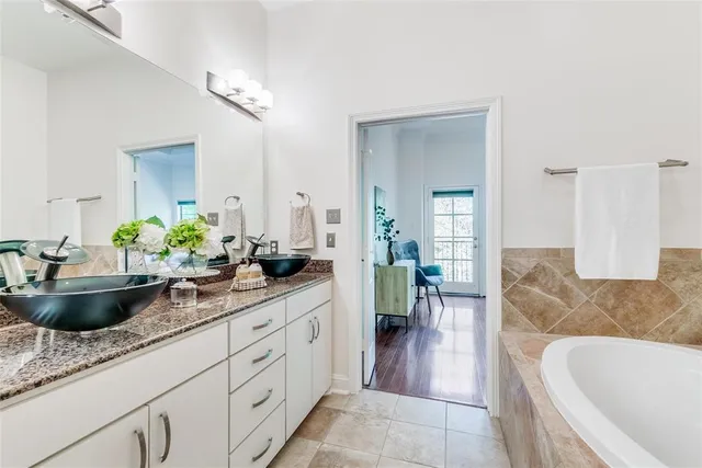 a living room with furniture and a sink