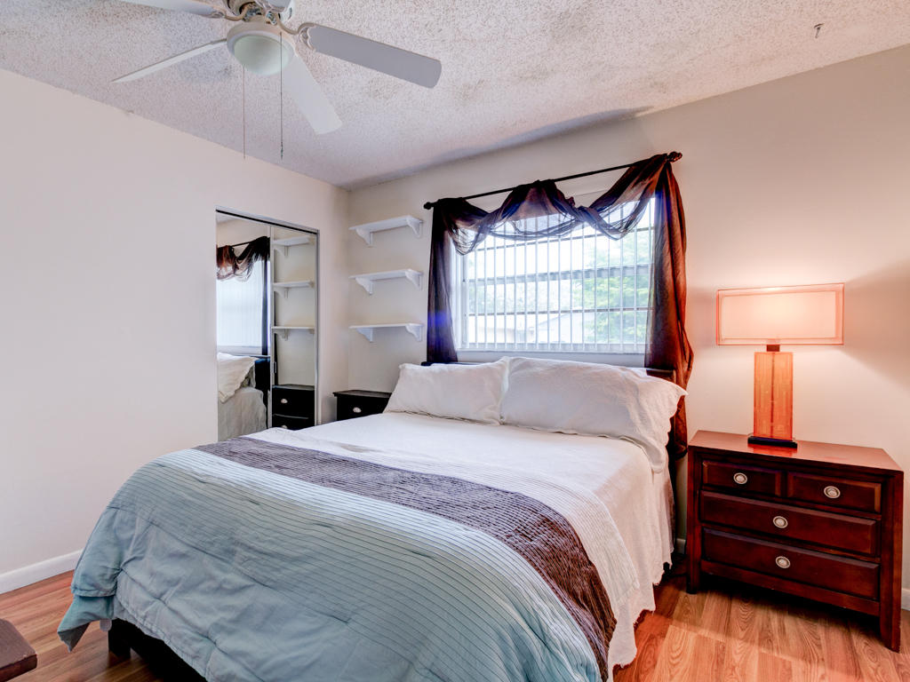 10494 Sleepy Brook Way Boca Raton, FL 33428 - Photo 15 of 30 a bedroom with a bed and a window