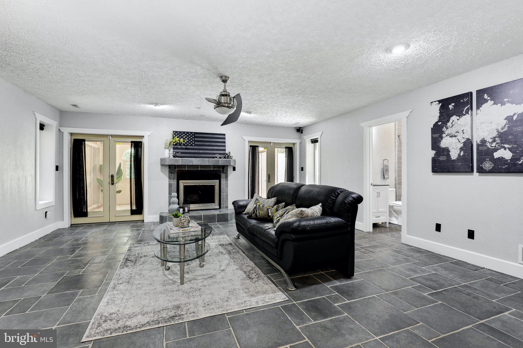7699 Paradise Beach Road Pasadena, MD 21122 - Photo 24 of 53 Family room with fireplace